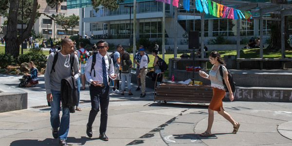 Students walking through Cesar Chavez Plaza